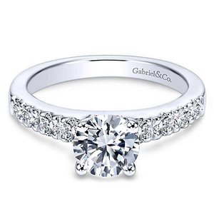 a diamond engagement ring with a pave setting
