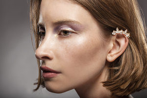 woman with ear cuff jewelry on the top of her ear