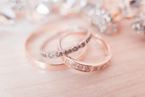 rose gold wedding rings on a light background, selective focus, macro
